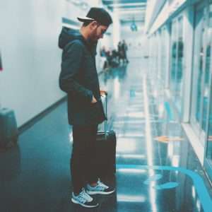 a man stands in an airport